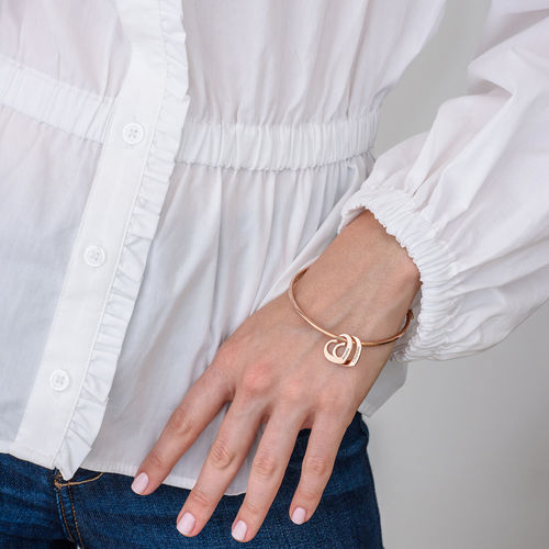 Bangle Bracelet with Heart Shape Pendants in Rose Gold Plating