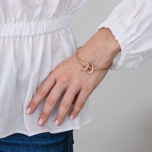 Bangle Bracelet with Round Shape Pendants in Rose Gold Plating