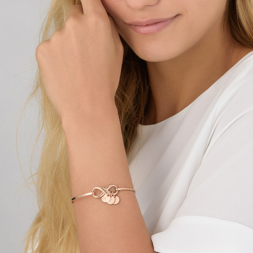 Infinity Bangle Bracelet with Initial Charms in Rose Gold Plating